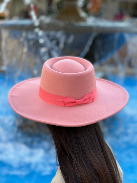A brushed woven fedora featuring a wide brim and velvet trim.