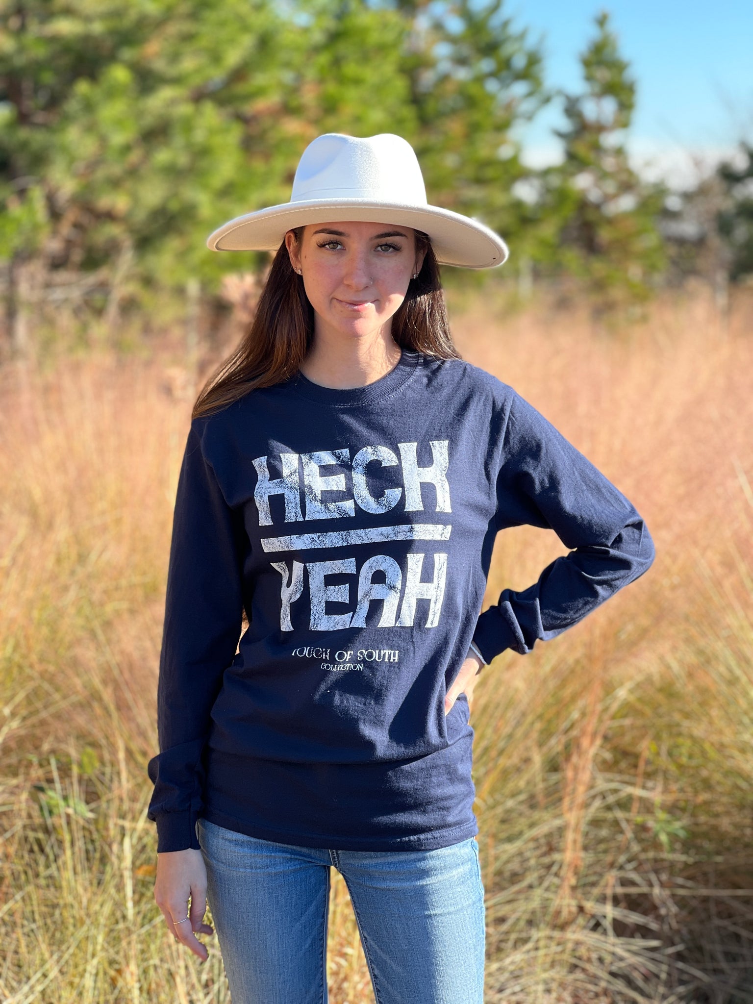 Navy long sleeve Southern T-shirt with "HECK YEAH" printed on the front.